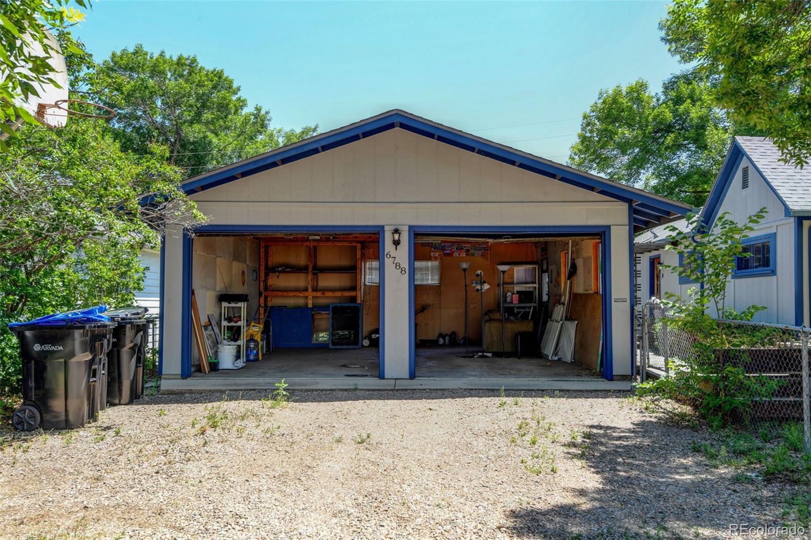 6788 Pierce Way Arvada, CO 80003 - Photo 2 of 28 a view of a house with a porch and furniture