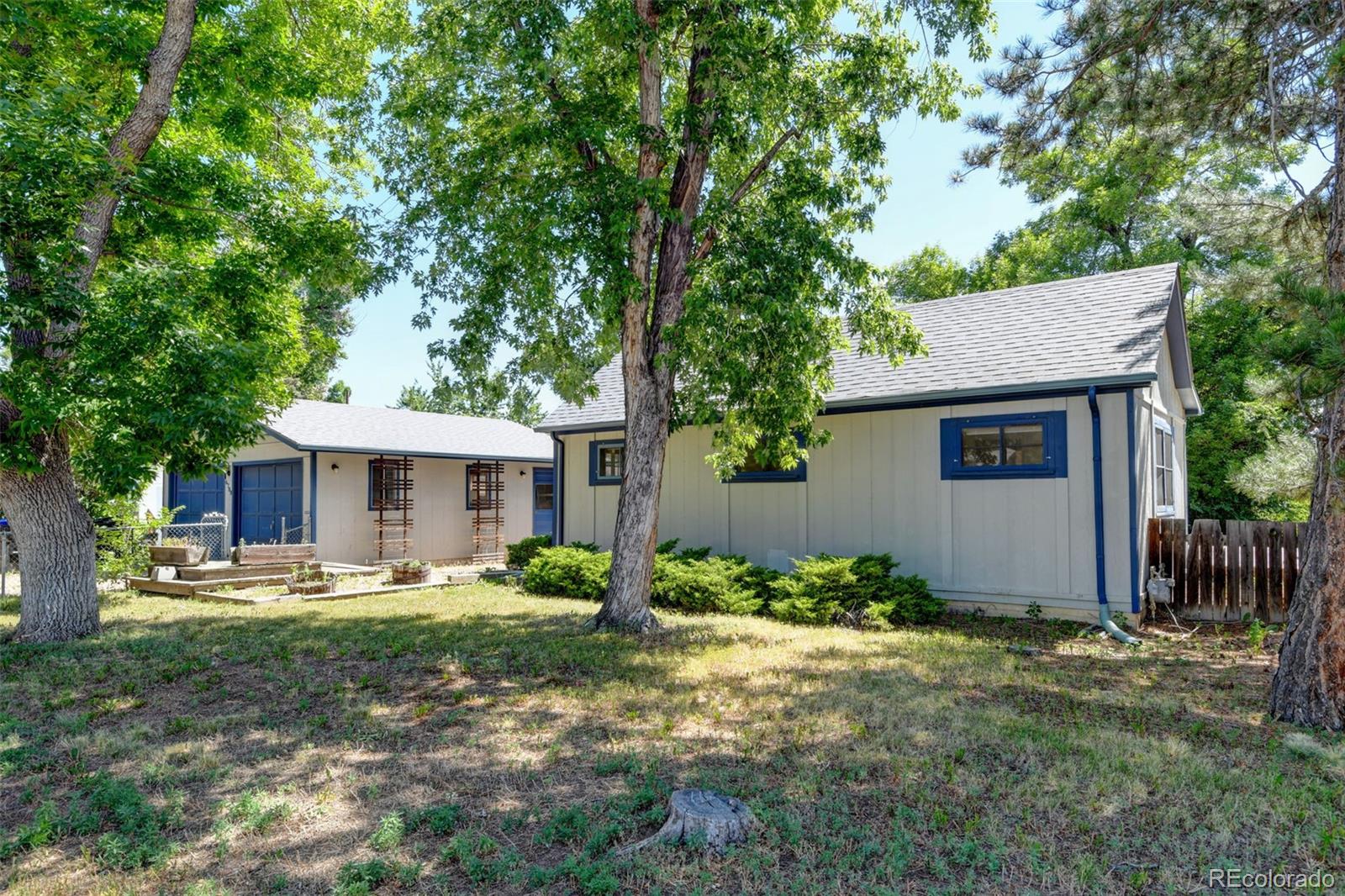 6788 Pierce Way Arvada, CO 80003 - Photo 22 of 28 a front view of a house with a yard