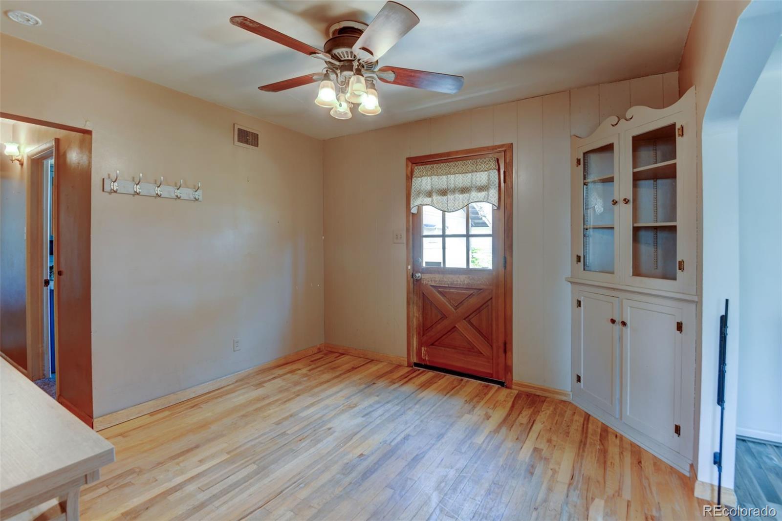 6788 Pierce Way Arvada, CO 80003 - Photo 8 of 28 wooden floor in an empty room with a window