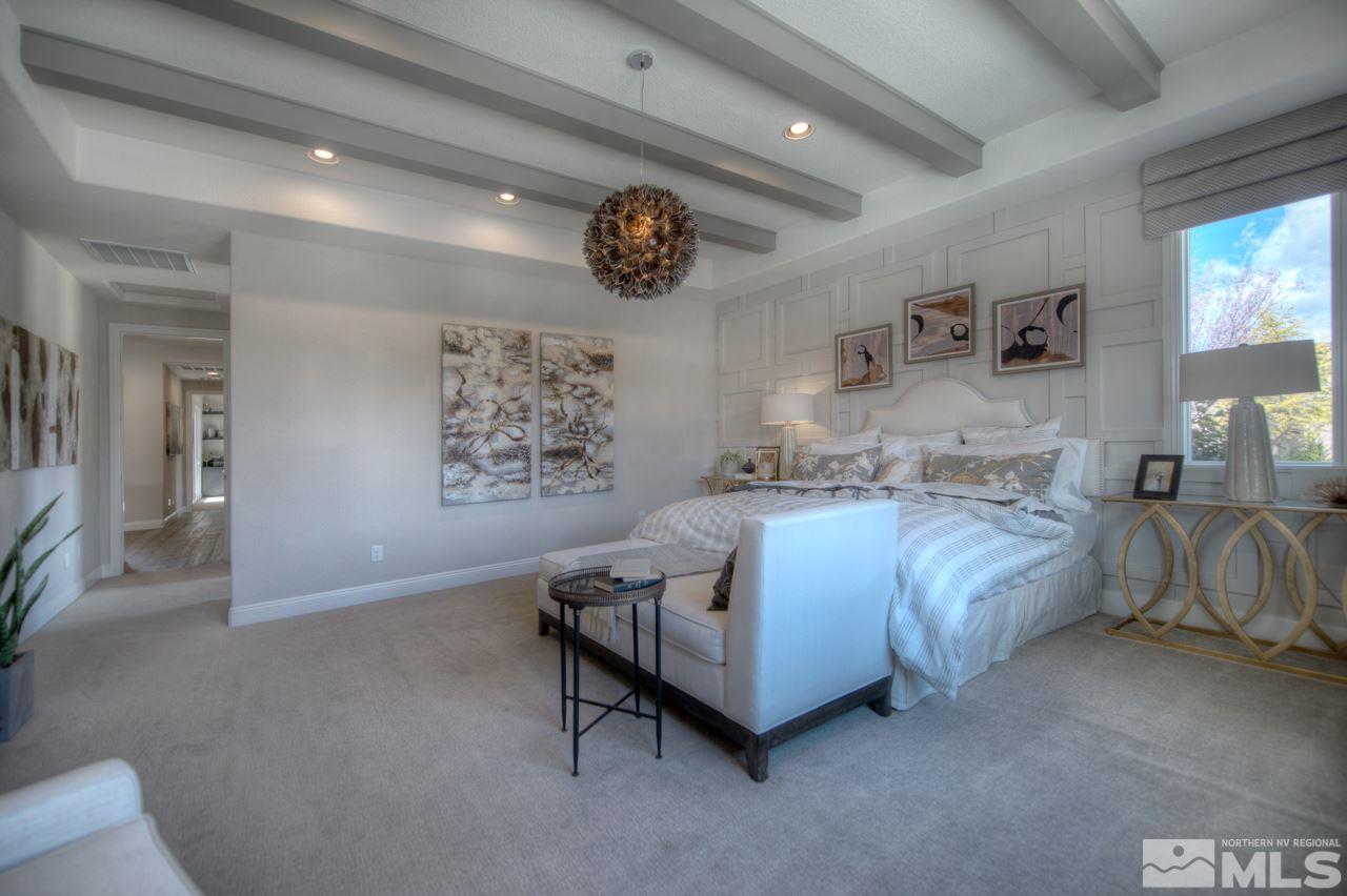 2095 Altair Lane, Unit MESSINA MODEL LOT 32 Reno, NV 89521 - Photo 15 of 25 a spacious bedroom with a bed and a large mirror