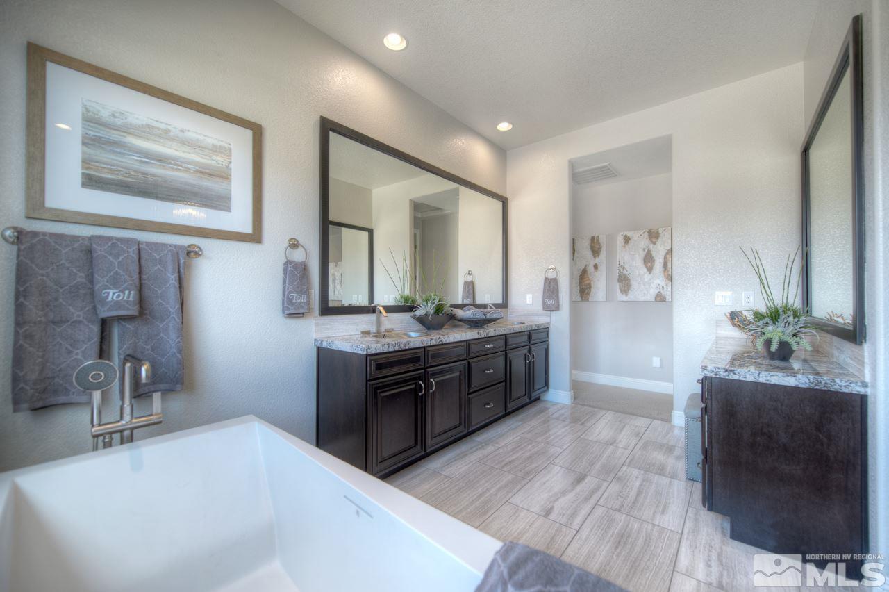 2095 Altair Lane, Unit MESSINA MODEL LOT 32 Reno, NV 89521 - Photo 17 of 25 a large bathroom with a tub sink and mirror