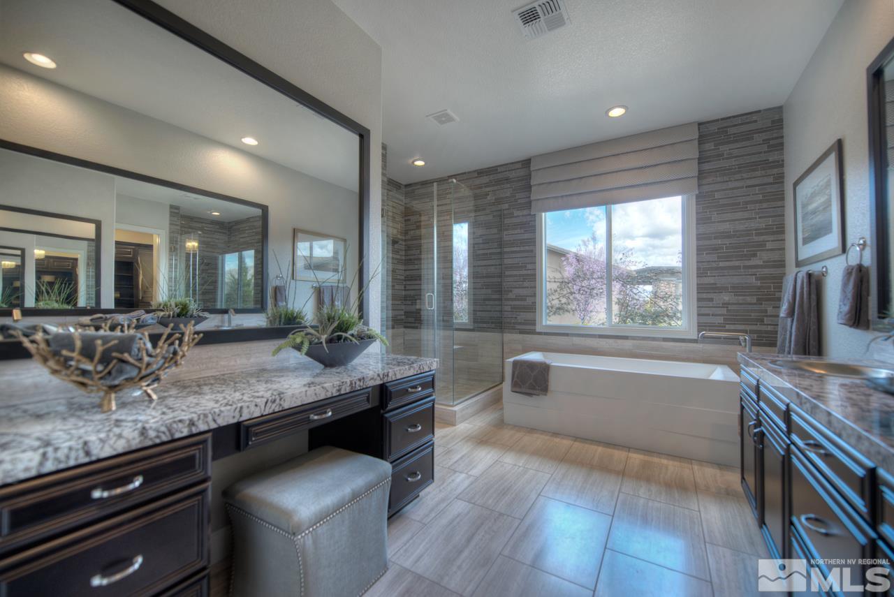 2095 Altair Lane, Unit MESSINA MODEL LOT 32 Reno, NV 89521 - Photo 18 of 25 a bathroom with a granite countertop sink mirror and bathtub