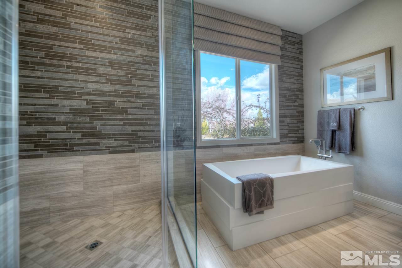 2095 Altair Lane, Unit MESSINA MODEL LOT 32 Reno, NV 89521 - Photo 19 of 25 a bathroom with a bathtub and a shower