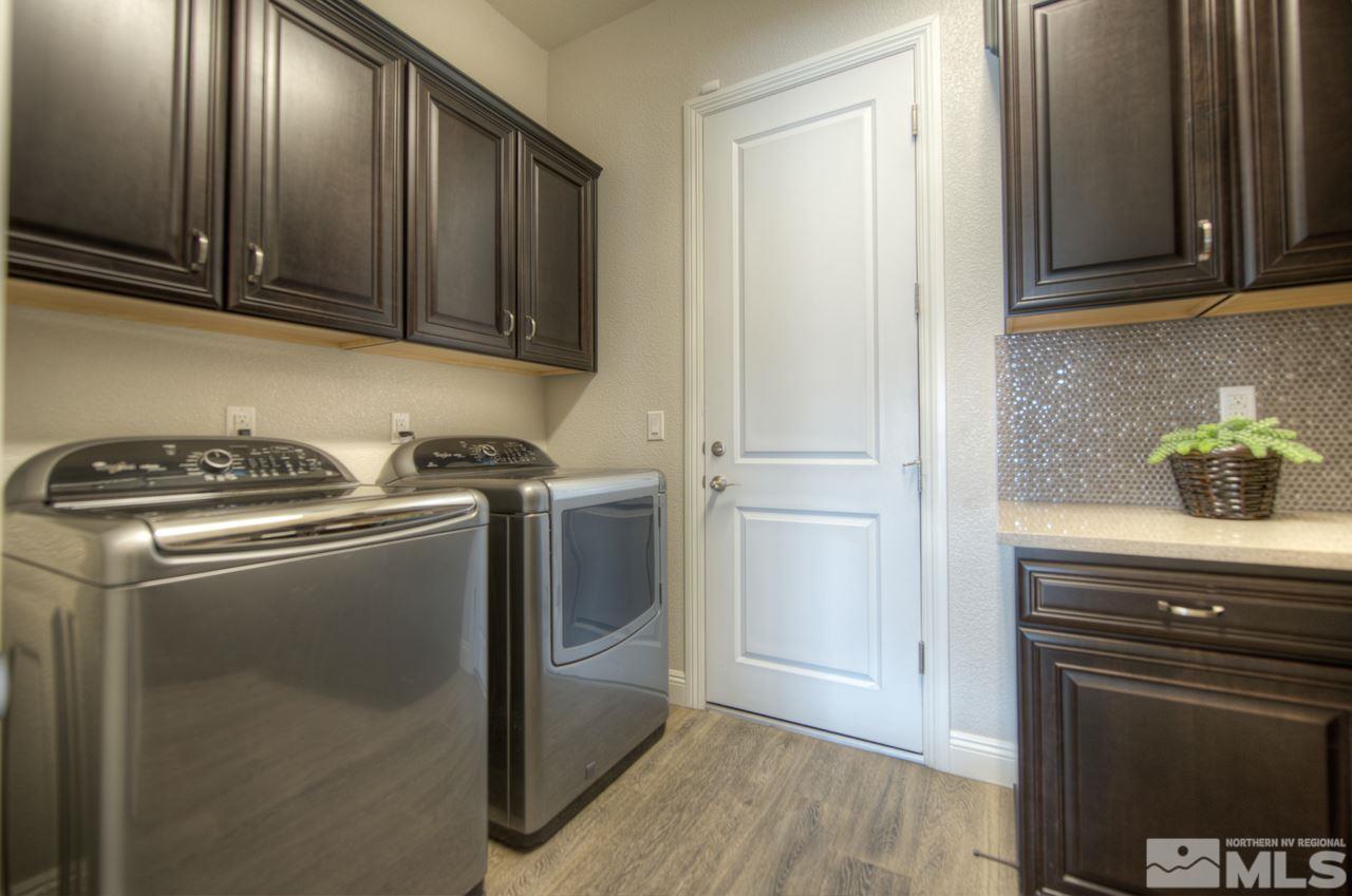 2095 Altair Lane, Unit MESSINA MODEL LOT 32 Reno, NV 89521 - Photo 22 of 25 a kitchen with granite countertop cabinets and steel stainless steel appliances