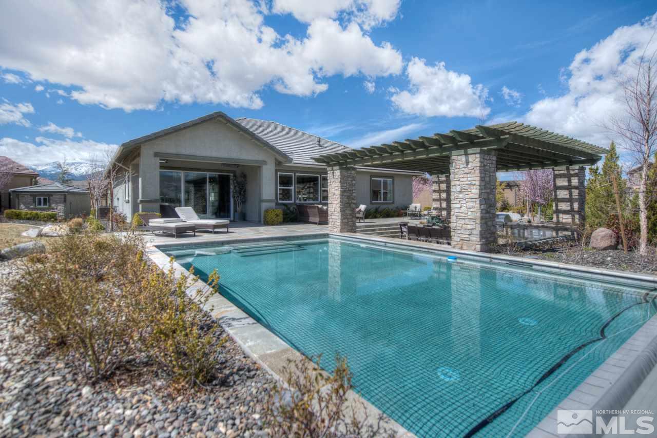 2095 Altair Lane, Unit MESSINA MODEL LOT 32 Reno, NV 89521 - Photo 24 of 25 a view of a house with swimming pool and sitting area