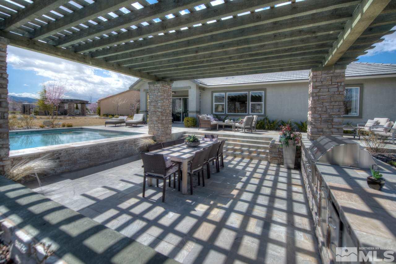 2095 Altair Lane, Unit MESSINA MODEL LOT 32 Reno, NV 89521 - Photo 25 of 25 a view of a porch with chairs and potted plants