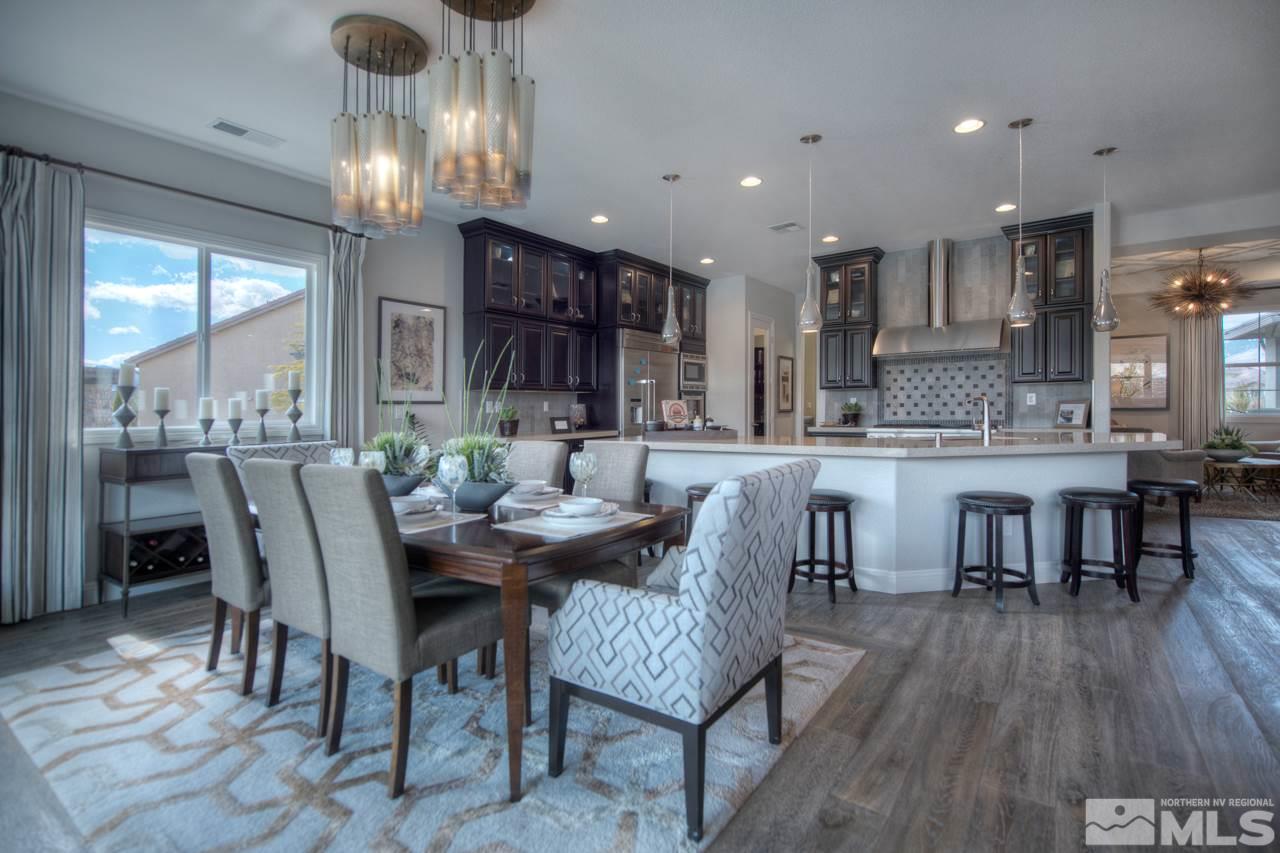 2095 Altair Lane, Unit MESSINA MODEL LOT 32 Reno, NV 89521 - Photo 5 of 25 a dining room with furniture a chandelier and wooden floor