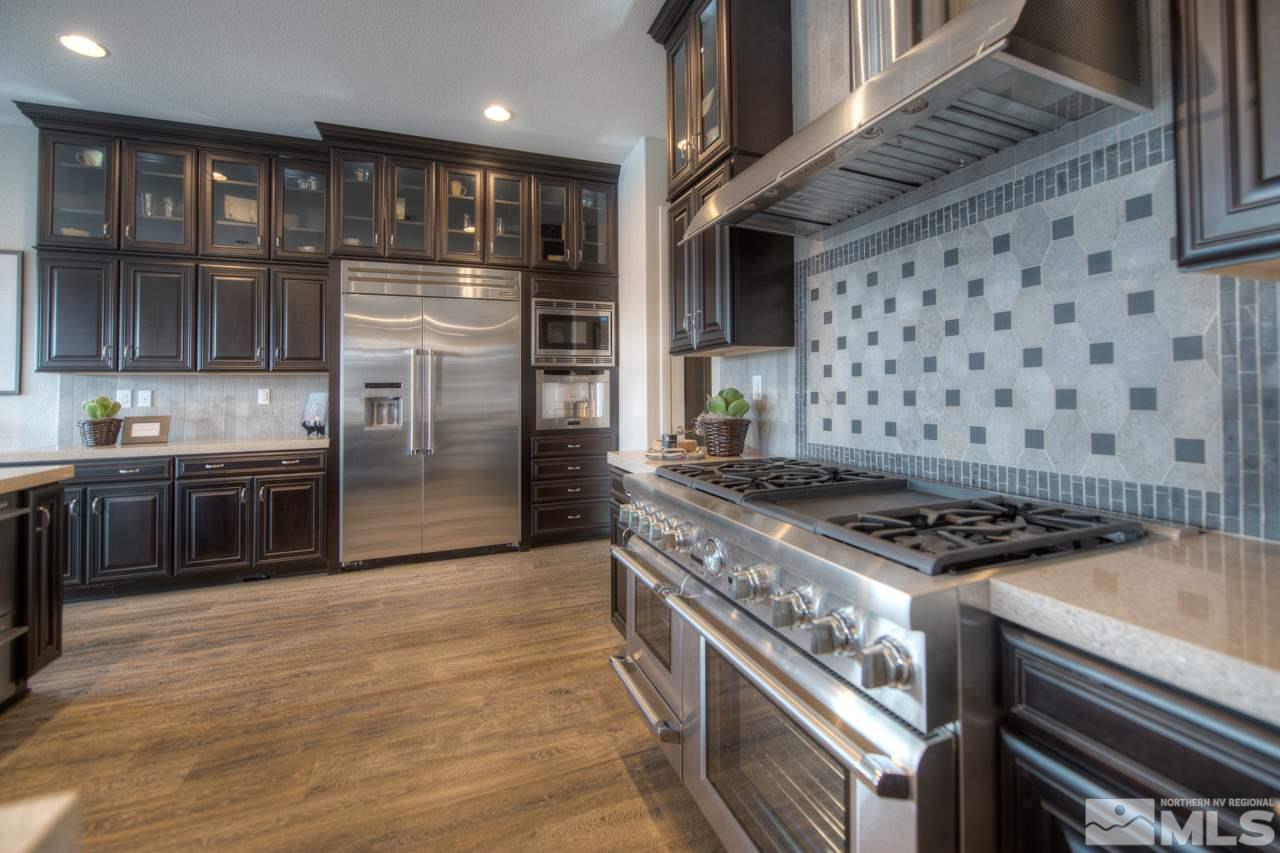 2095 Altair Lane, Unit MESSINA MODEL LOT 32 Reno, NV 89521 - Photo 6 of 25 a kitchen with a stove and a refrigerator