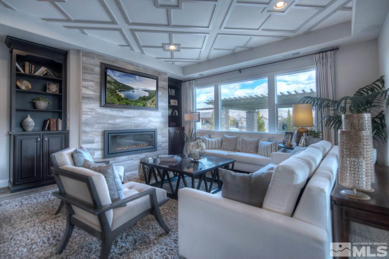 2095 Altair Lane, Unit MESSINA MODEL LOT 32 Reno, NV 89521 - Photo 10 of 25 a living room with furniture a flat screen tv and a fireplace