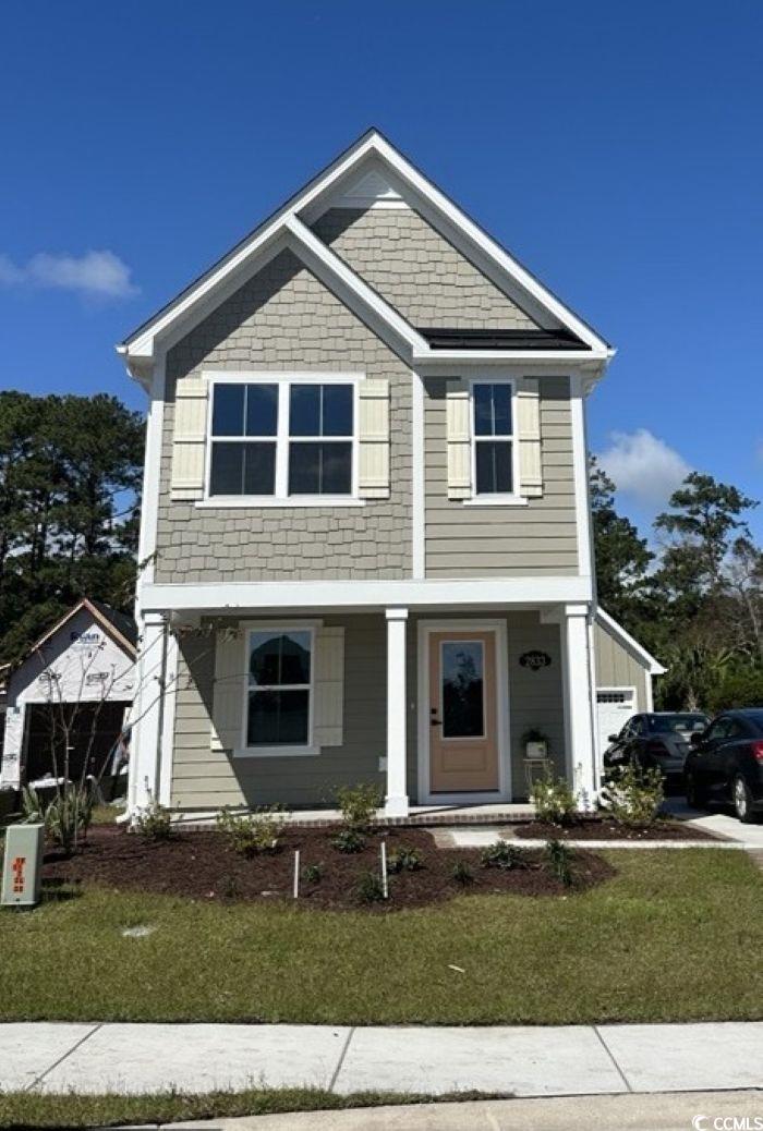 2833 Rowyn Street Longs, SC 29568 - Photo 1 of 1 View of front of property featuring a porch, a garage, and a front yard