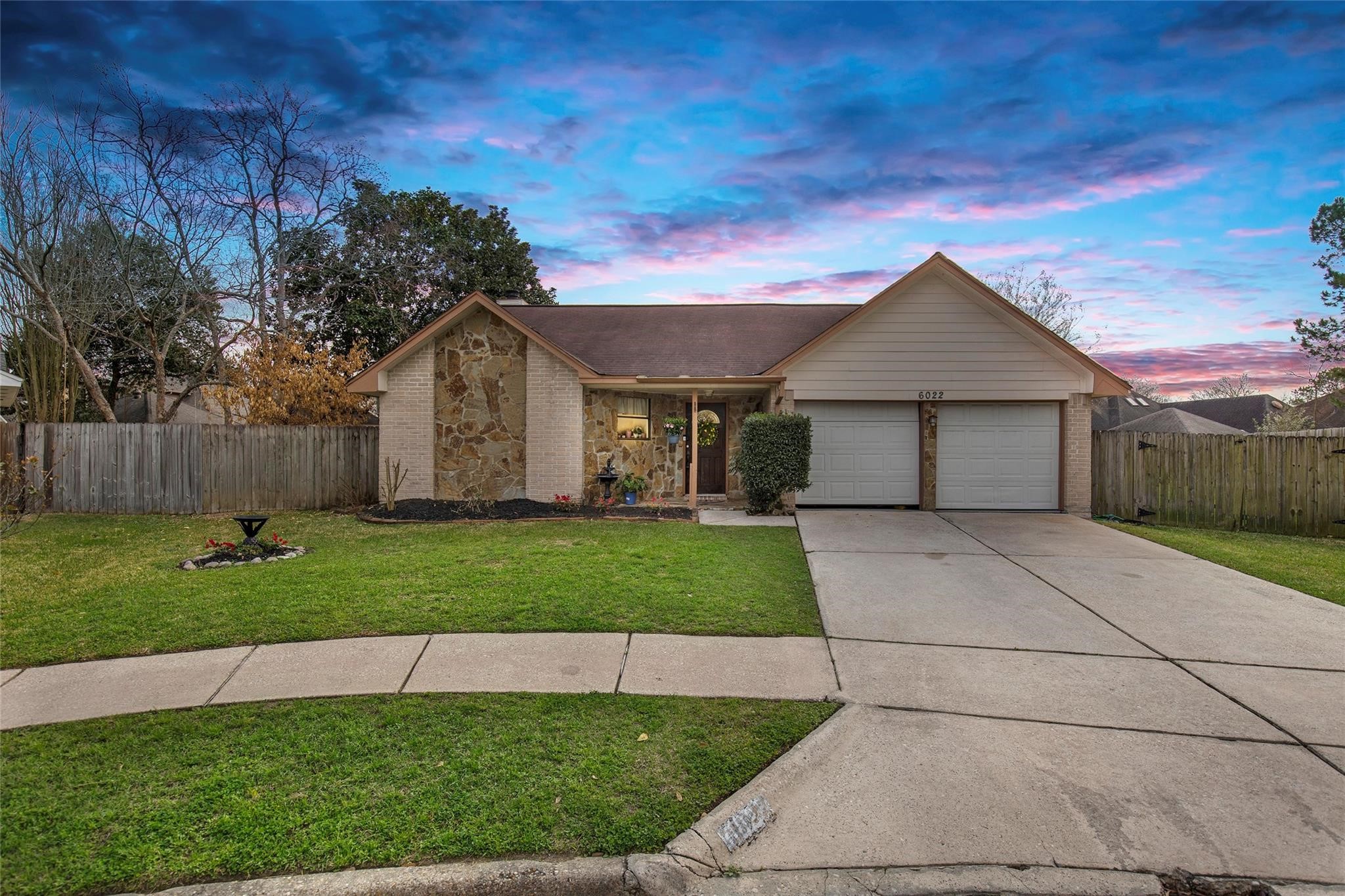 6022 Sean Court Humble, TX 77346 - Photo 1 of 18 a front view of a house with a yard