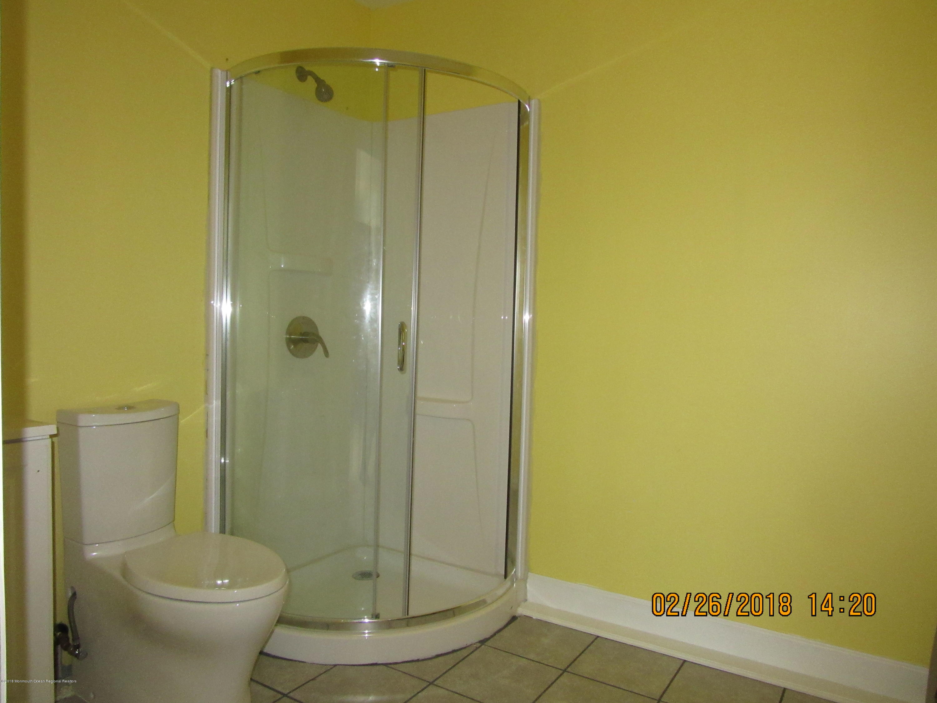 174 Raritan Street Keyport, NJ 07735 - Photo 12 of 23 a bathroom with a shower and a toilet