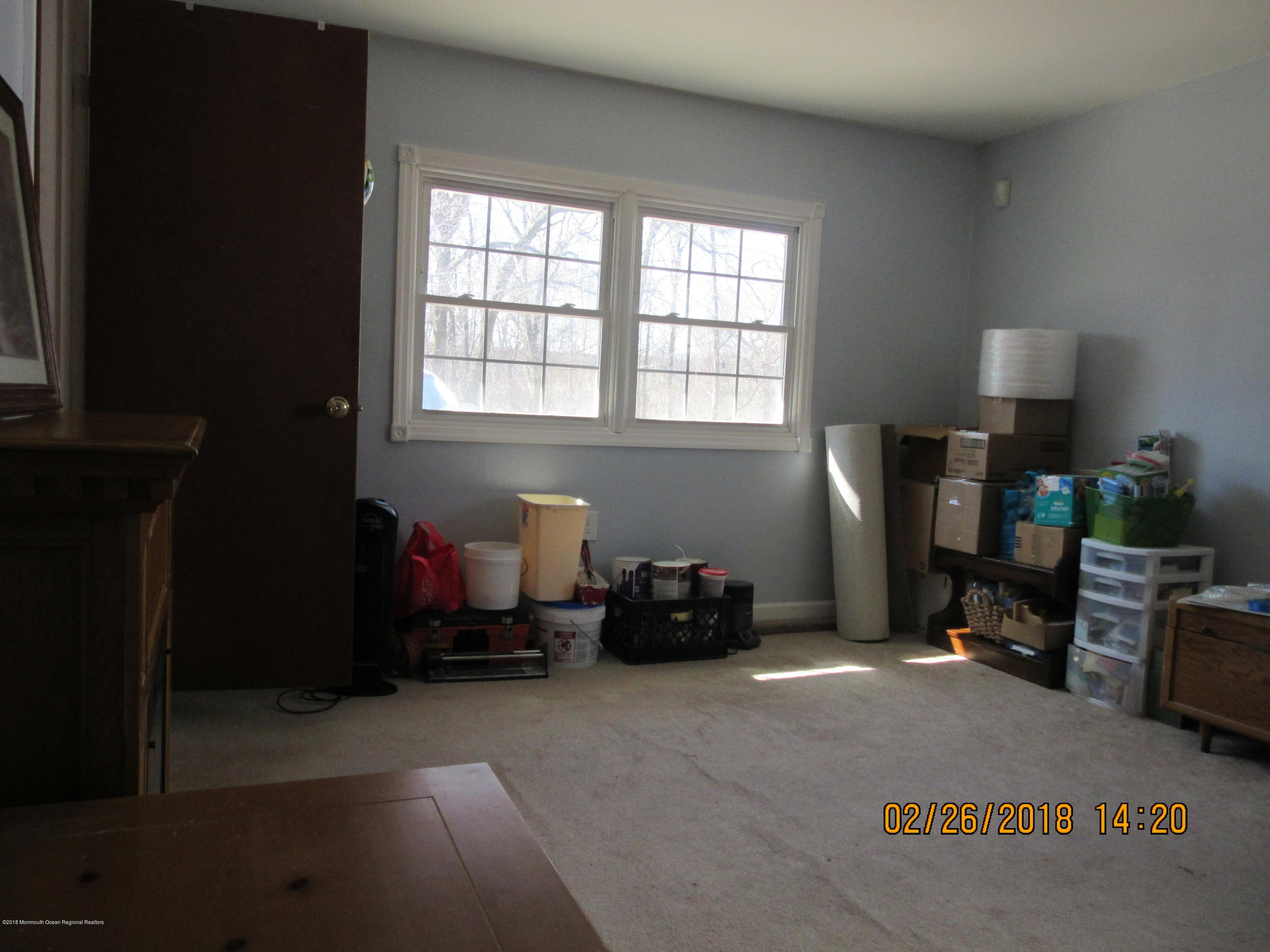 174 Raritan Street Keyport, NJ 07735 - Photo 13 of 23 a bedroom with furniture and a window