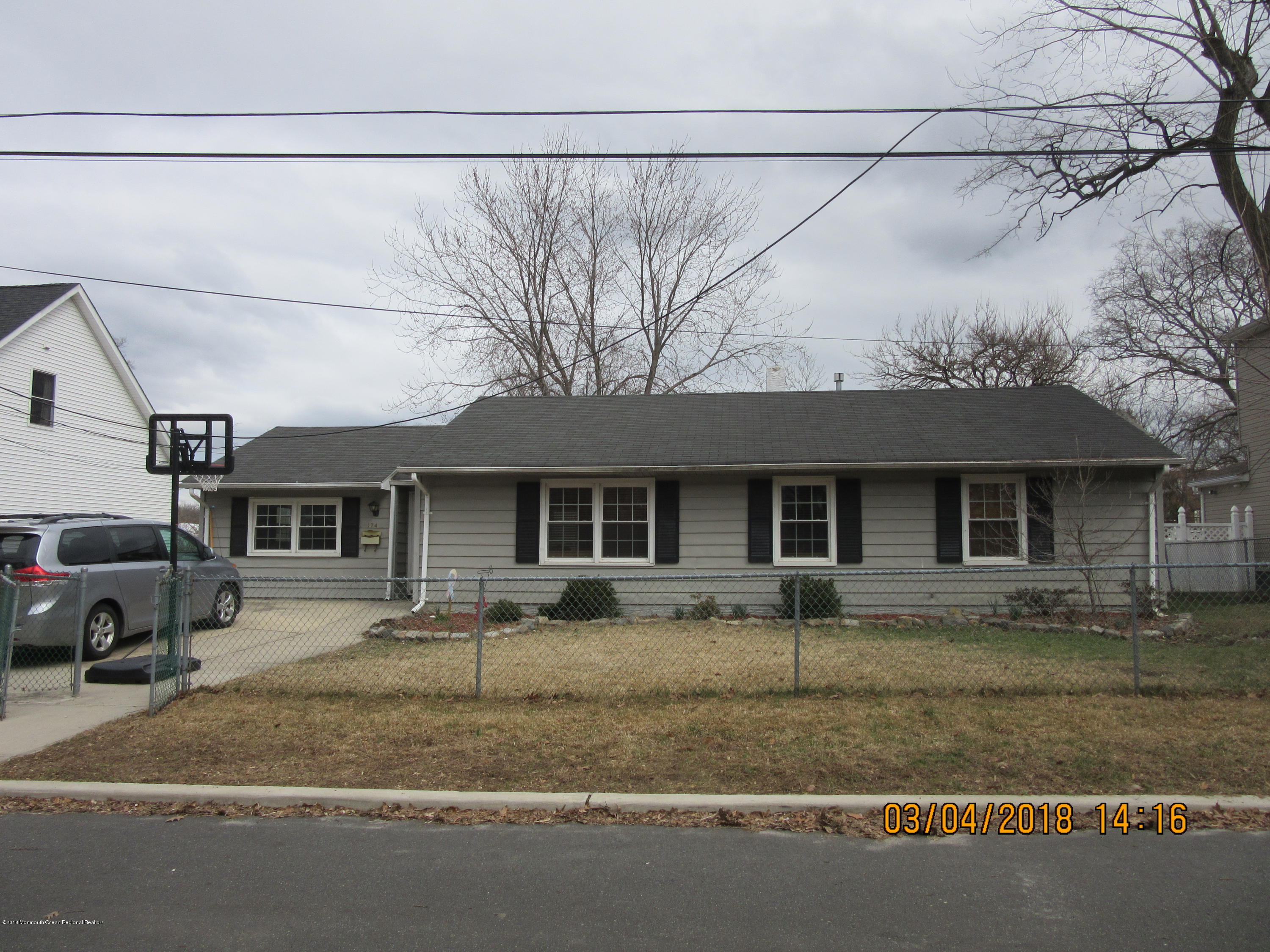 174 Raritan Street Keyport, NJ 07735 - Photo 17 of 23 a front view of a house with a yard