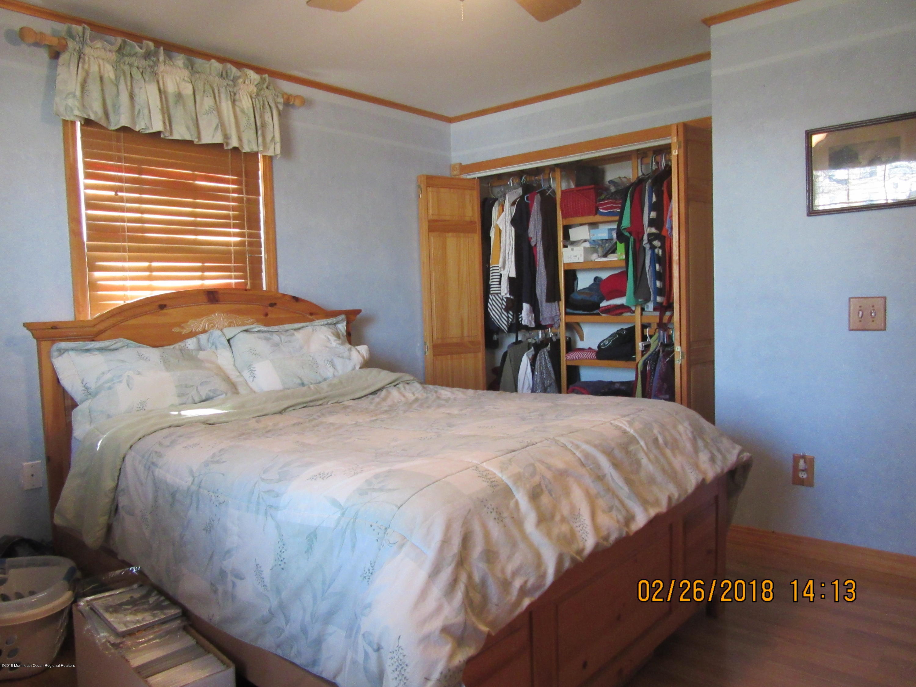 174 Raritan Street Keyport, NJ 07735 - Photo 3 of 23 a bedroom with a bed and wooden floor