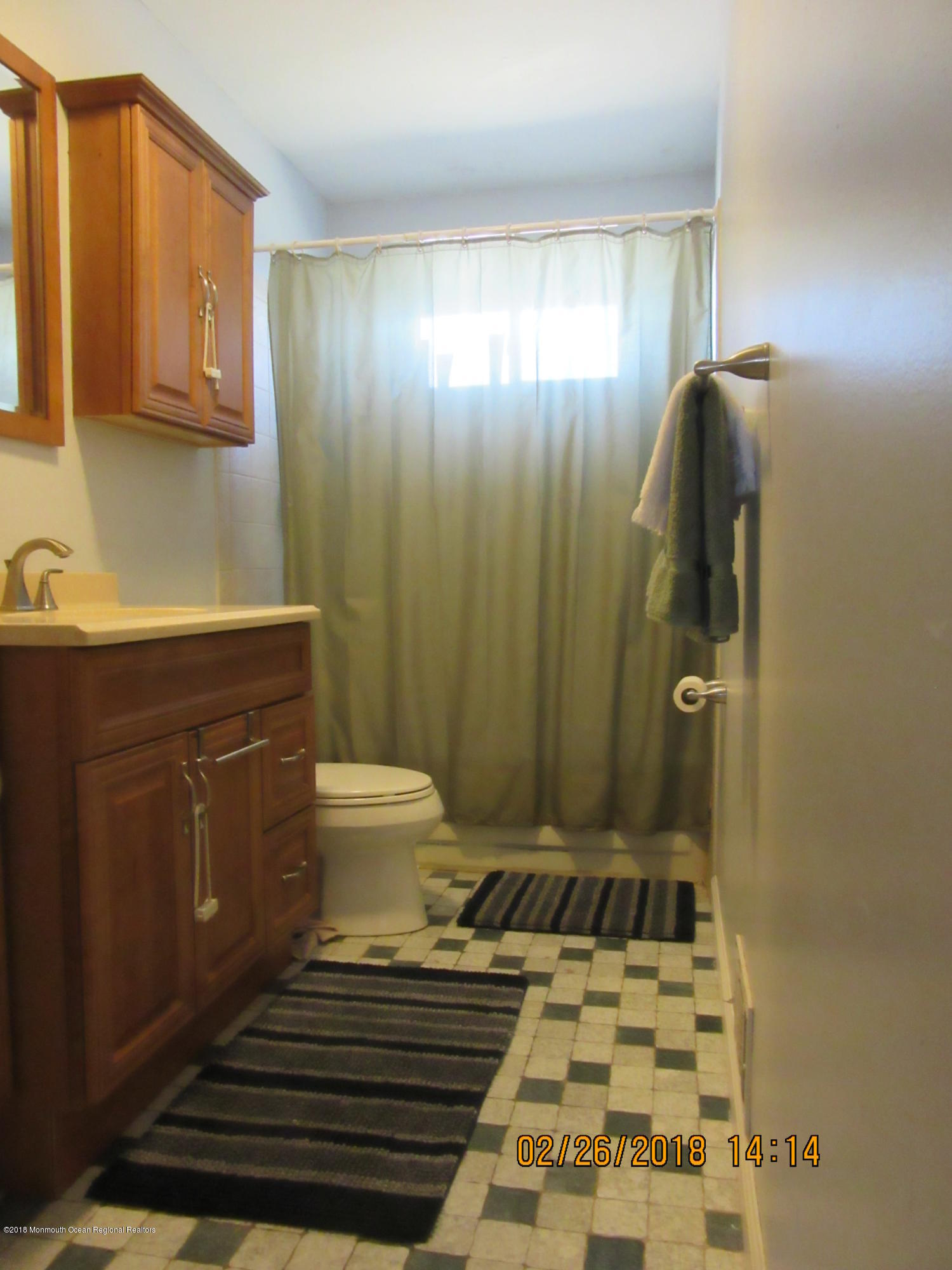 174 Raritan Street Keyport, NJ 07735 - Photo 4 of 23 a bathroom with a sink toilet and shower