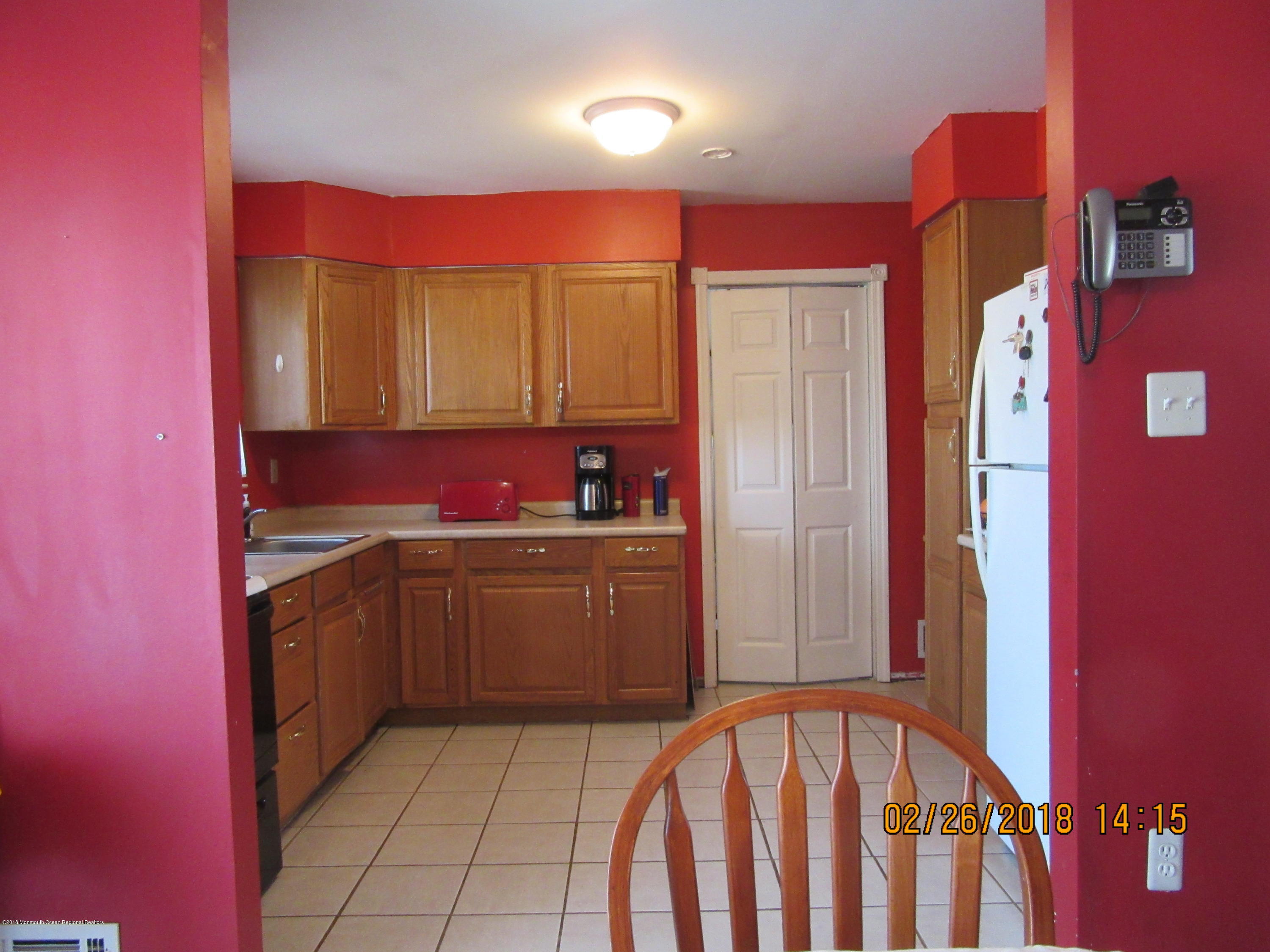 174 Raritan Street Keyport, NJ 07735 - Photo 6 of 23 a kitchen with a sink stove and cabinets