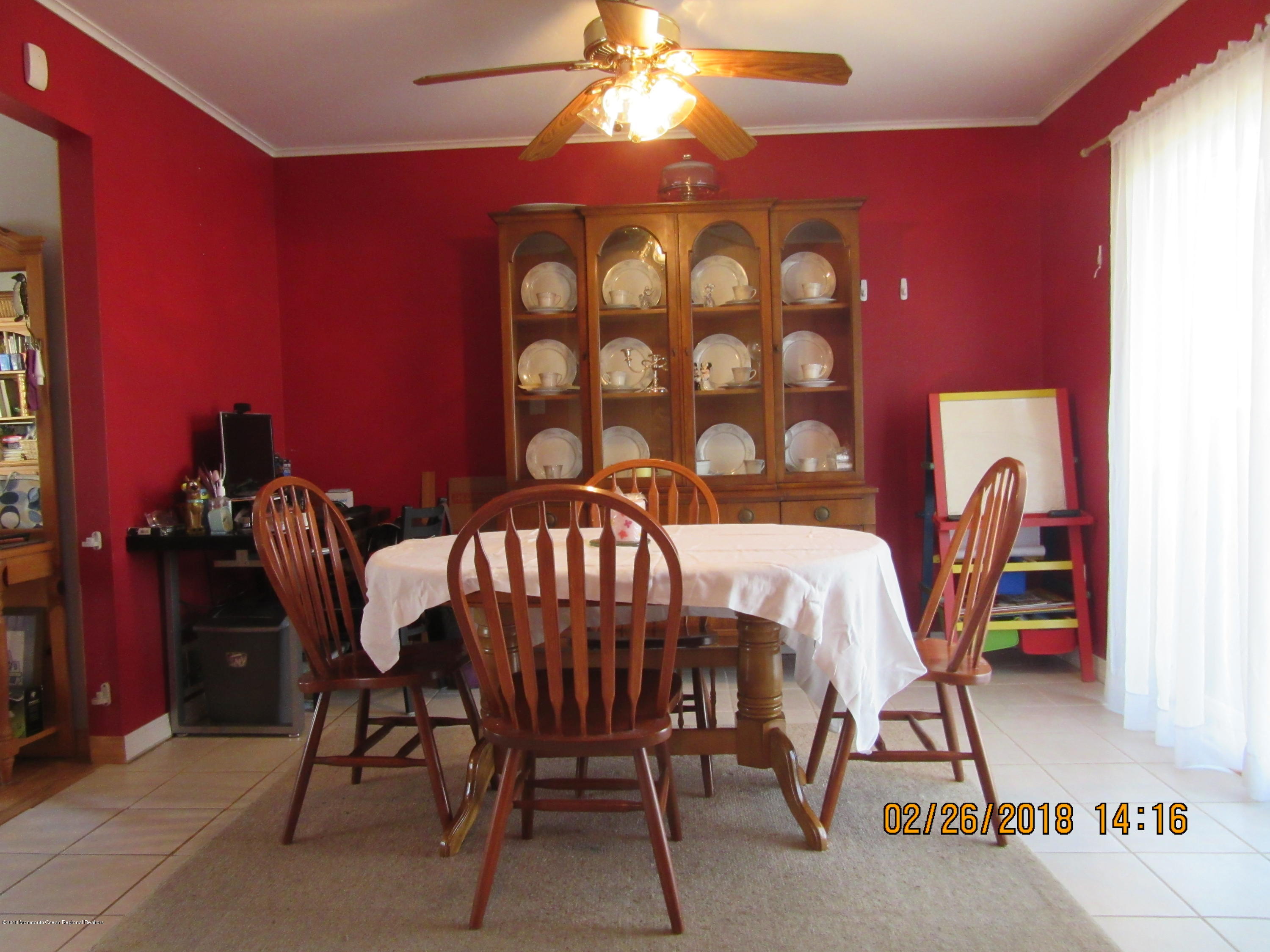 174 Raritan Street Keyport, NJ 07735 - Photo 7 of 23 a view of a dining room with furniture and chandelier