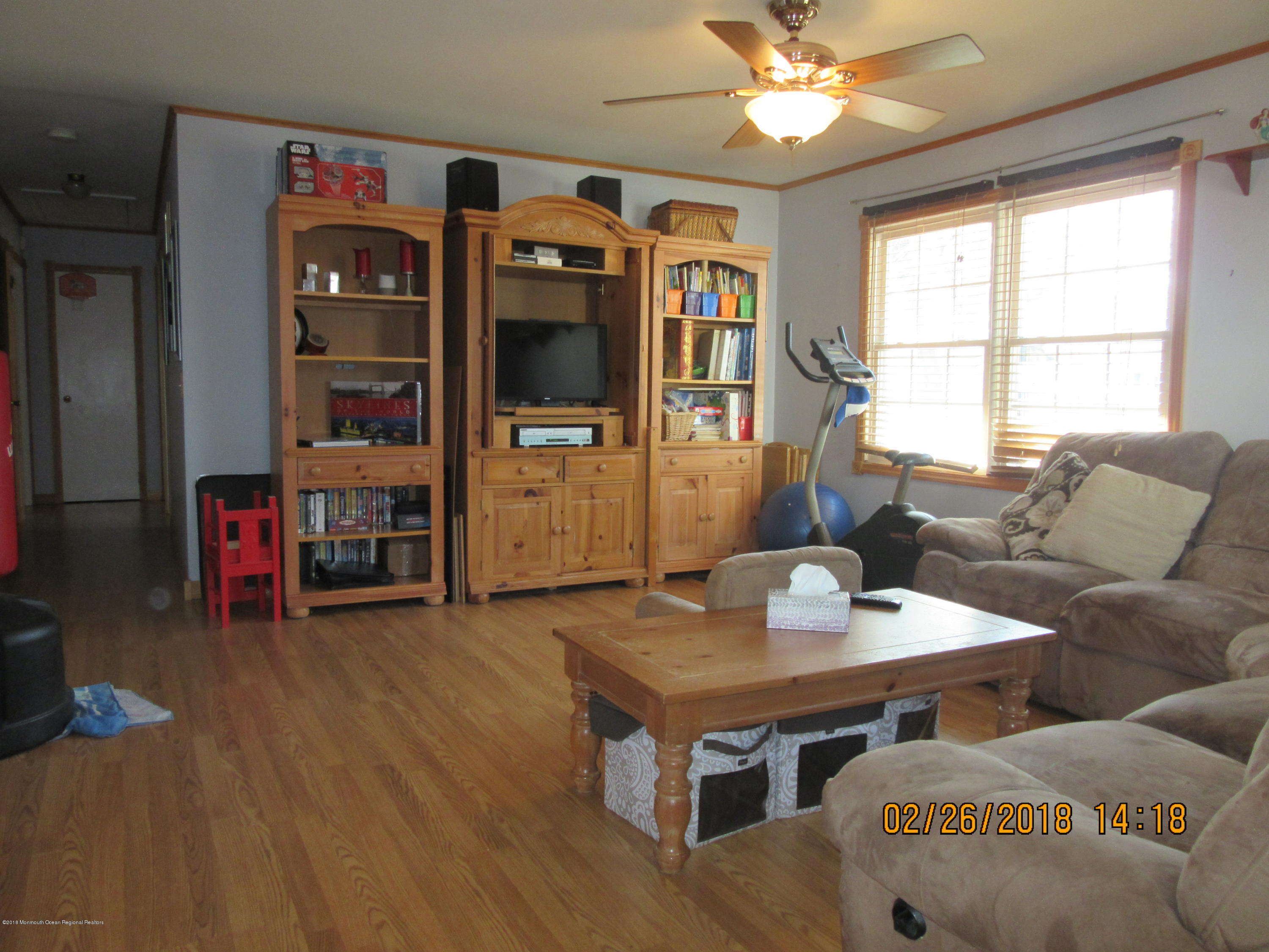 174 Raritan Street Keyport, NJ 07735 - Photo 9 of 23 a living room with furniture a flat screen tv and a large window