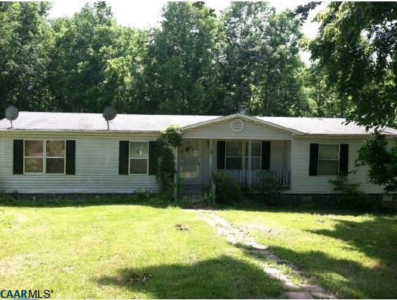 a view of house with yard