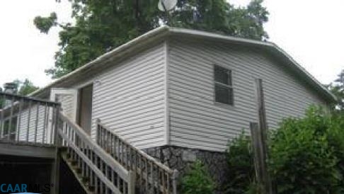 7898 Porters Road Esmont, VA 22937 - Photo 3 of 10 a view of house with backyard and trees