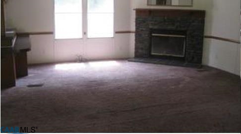 7898 Porters Road Esmont, VA 22937 - Photo 7 of 10 a view of empty room with a fireplace