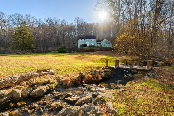a view of a lake with a yard