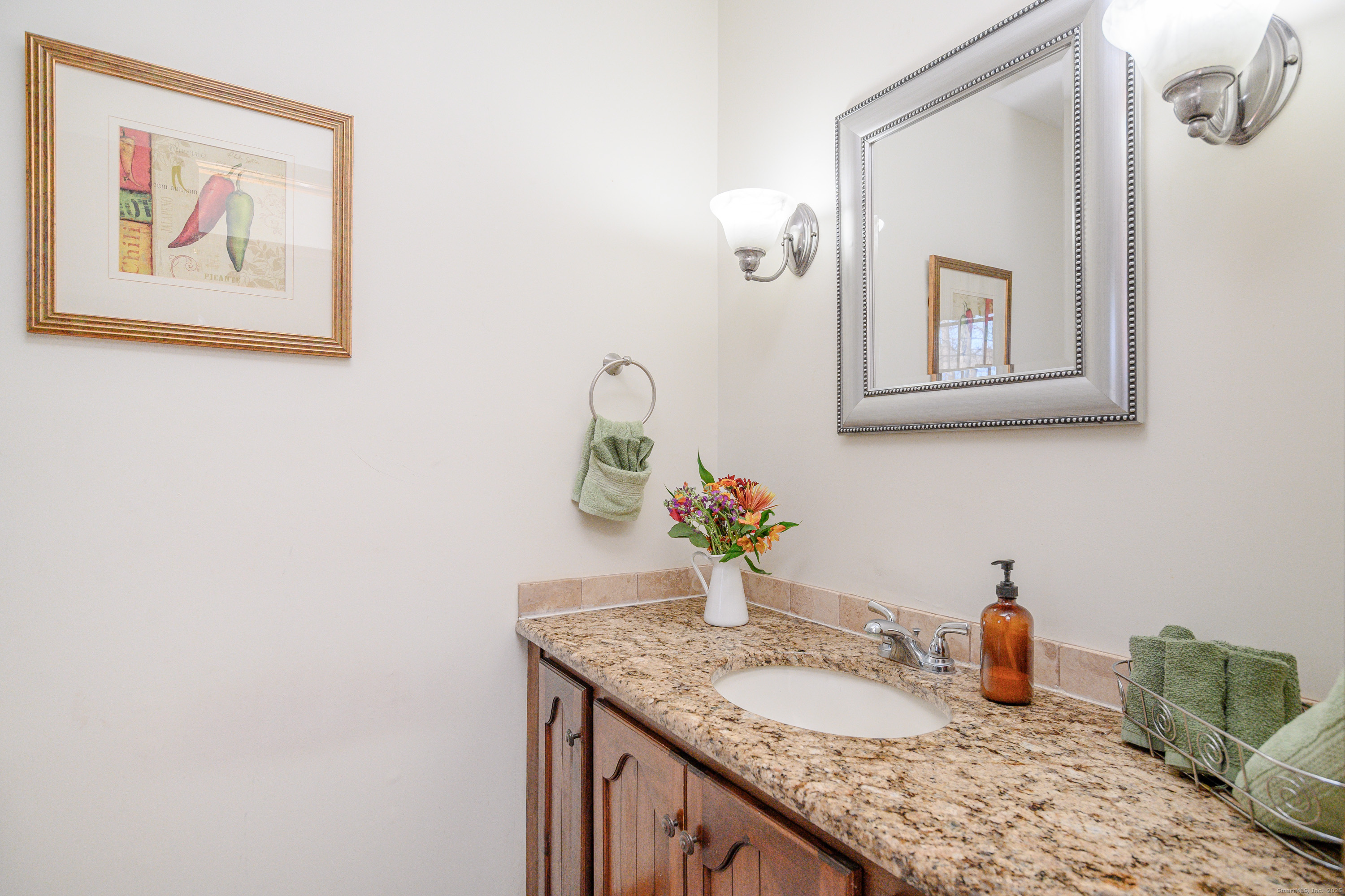 14 Concord Ridge Road Newtown, CT 06482 - Photo 15 of 40 a bathroom with a granite countertop sink a mirror and vanity