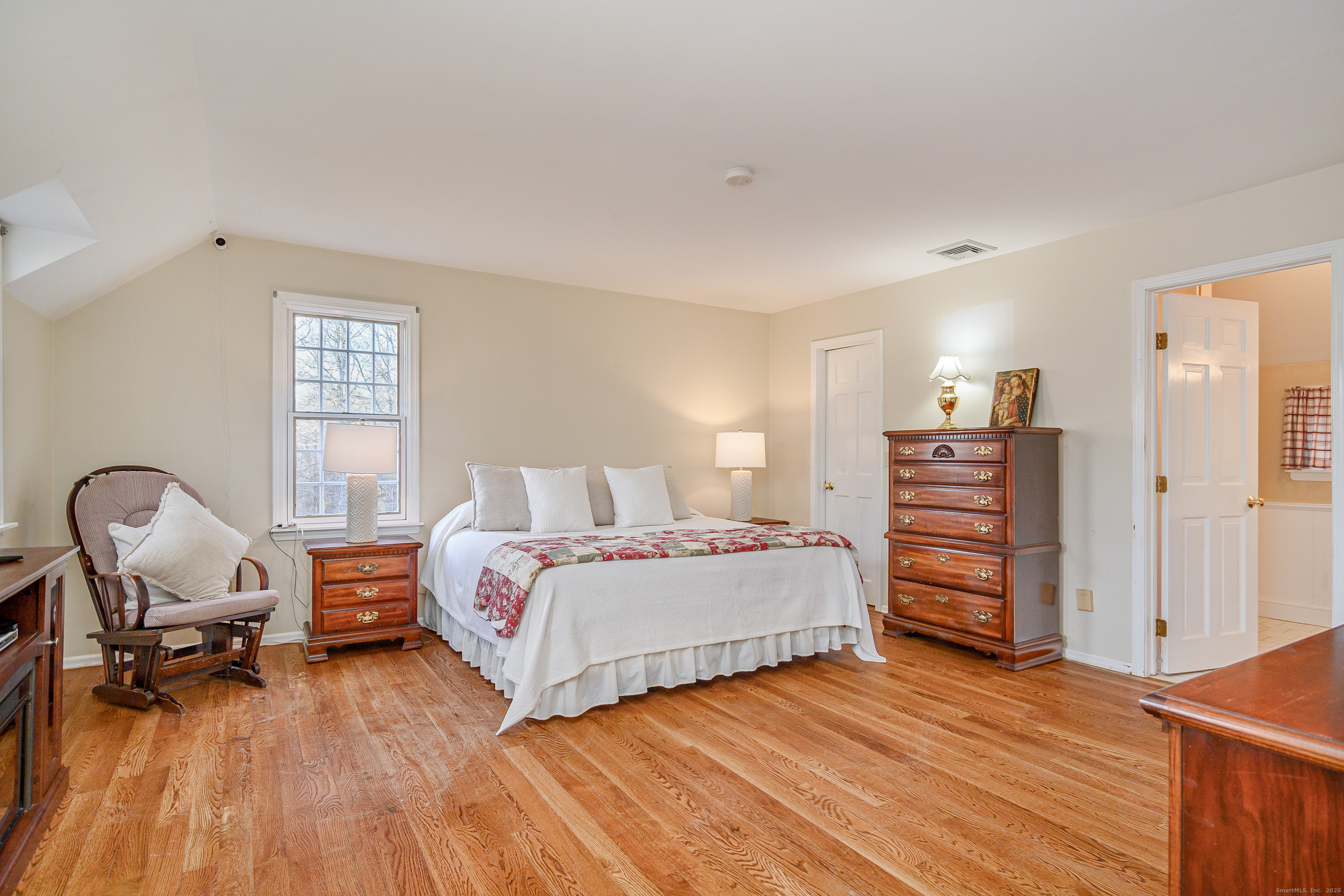 14 Concord Ridge Road Newtown, CT 06482 - Photo 16 of 40 a bedroom with a bed and wooden floor