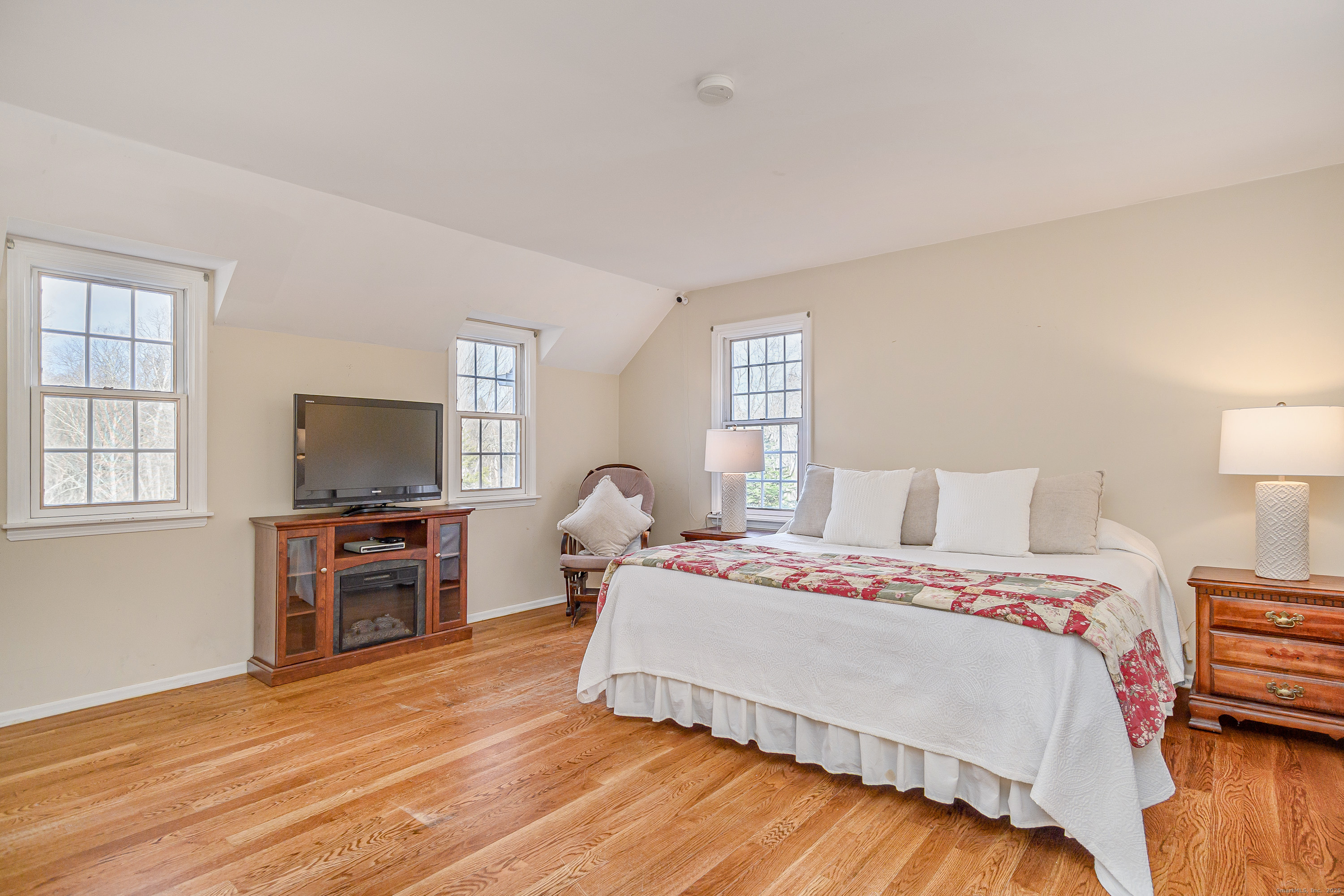 14 Concord Ridge Road Newtown, CT 06482 - Photo 17 of 40 a bedroom with a bed and a flat screen tv