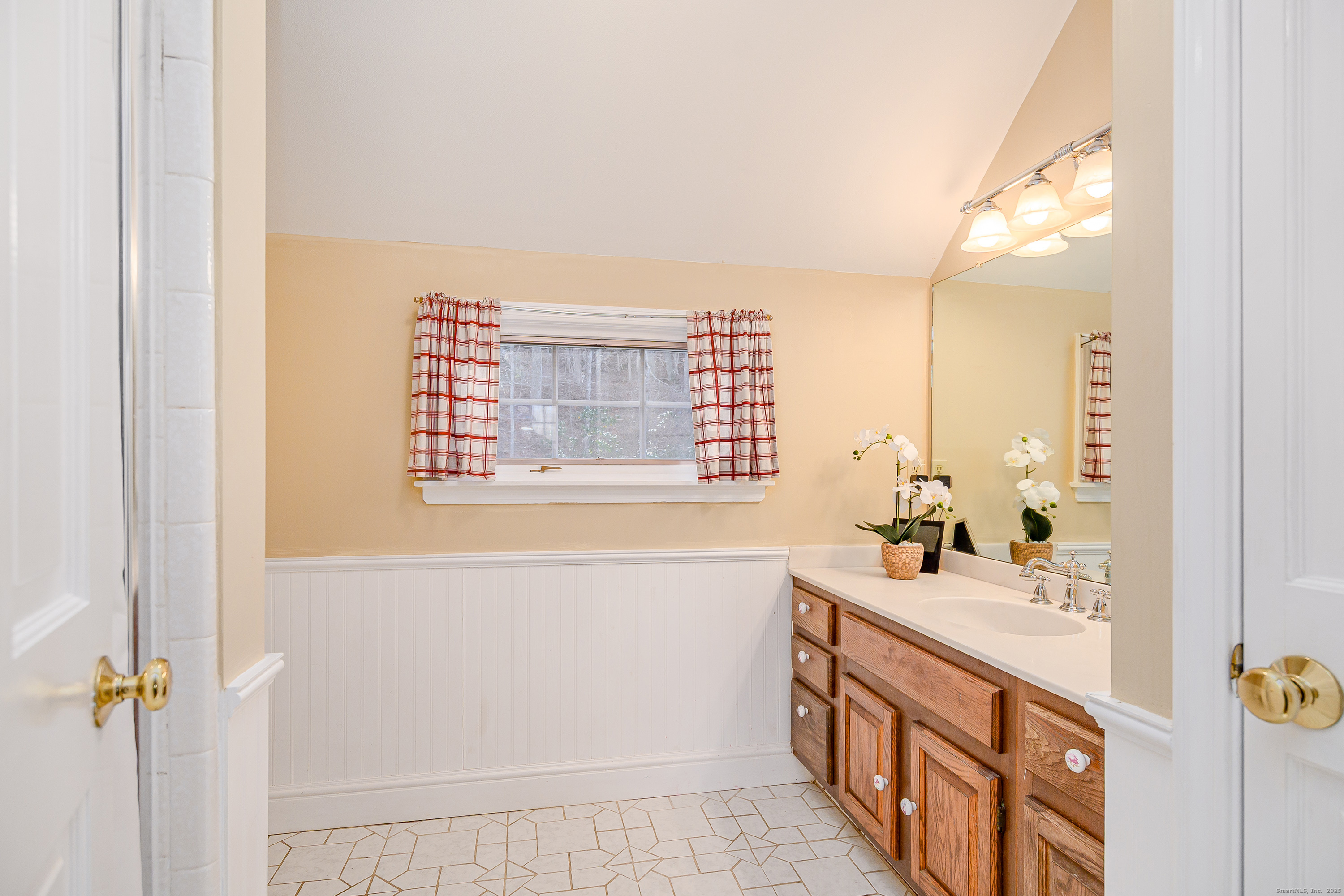 14 Concord Ridge Road Newtown, CT 06482 - Photo 18 of 40 a bathroom with a sink a vanity and a mirror