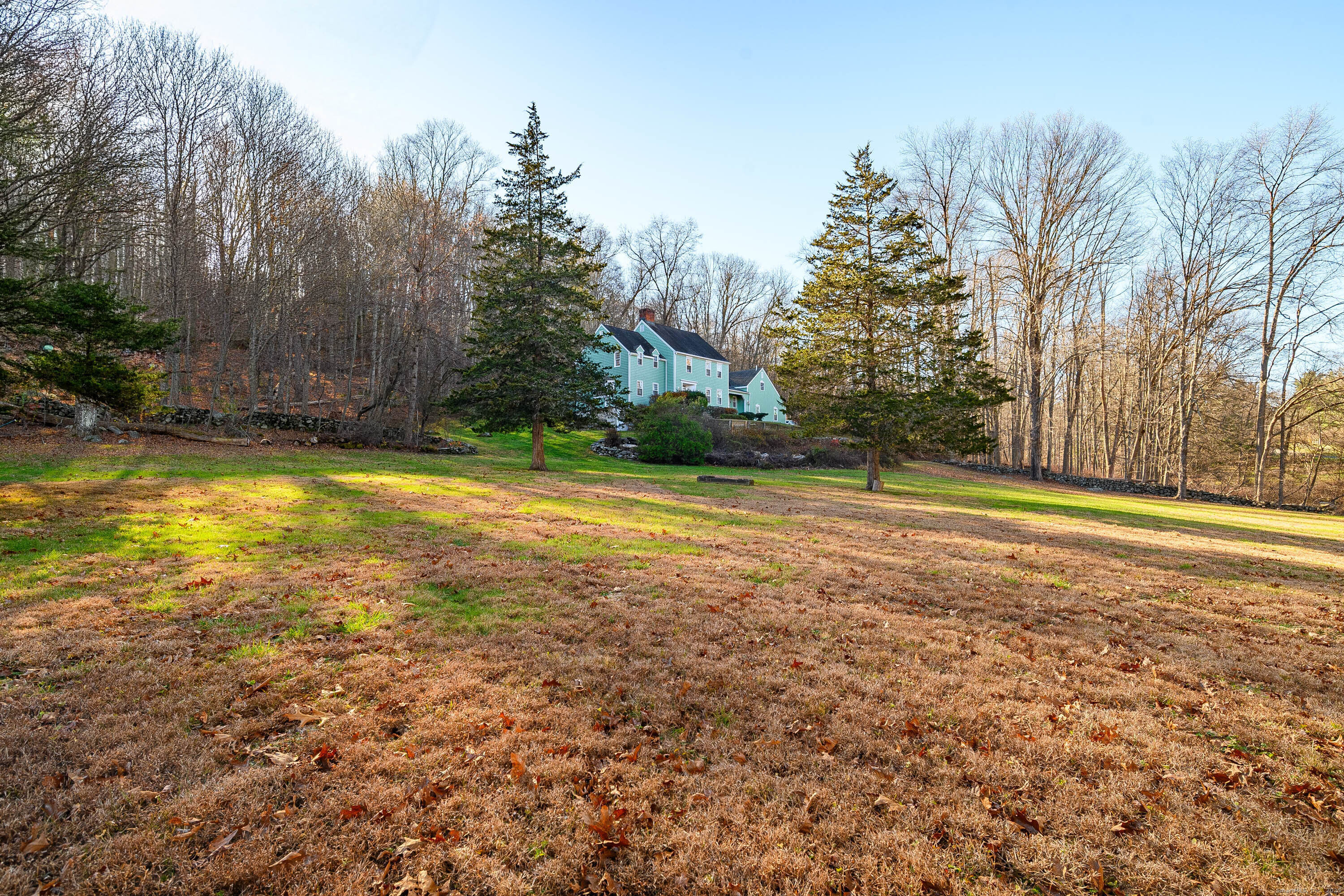14 Concord Ridge Road Newtown, CT 06482 - Photo 2 of 40 a view of a swimming pool with an outdoor space and seating area