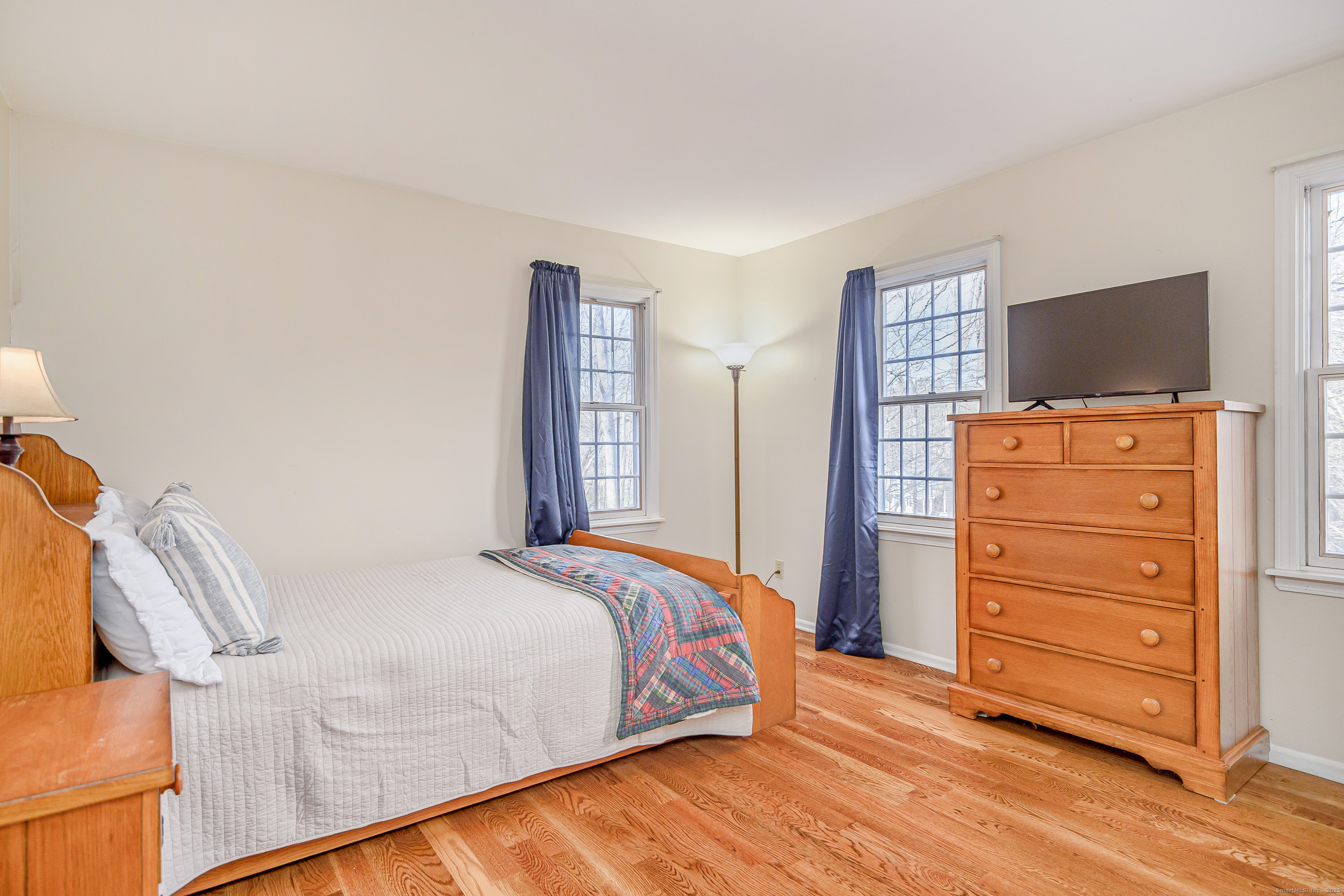 14 Concord Ridge Road Newtown, CT 06482 - Photo 22 of 40 a bedroom with a bed and chair