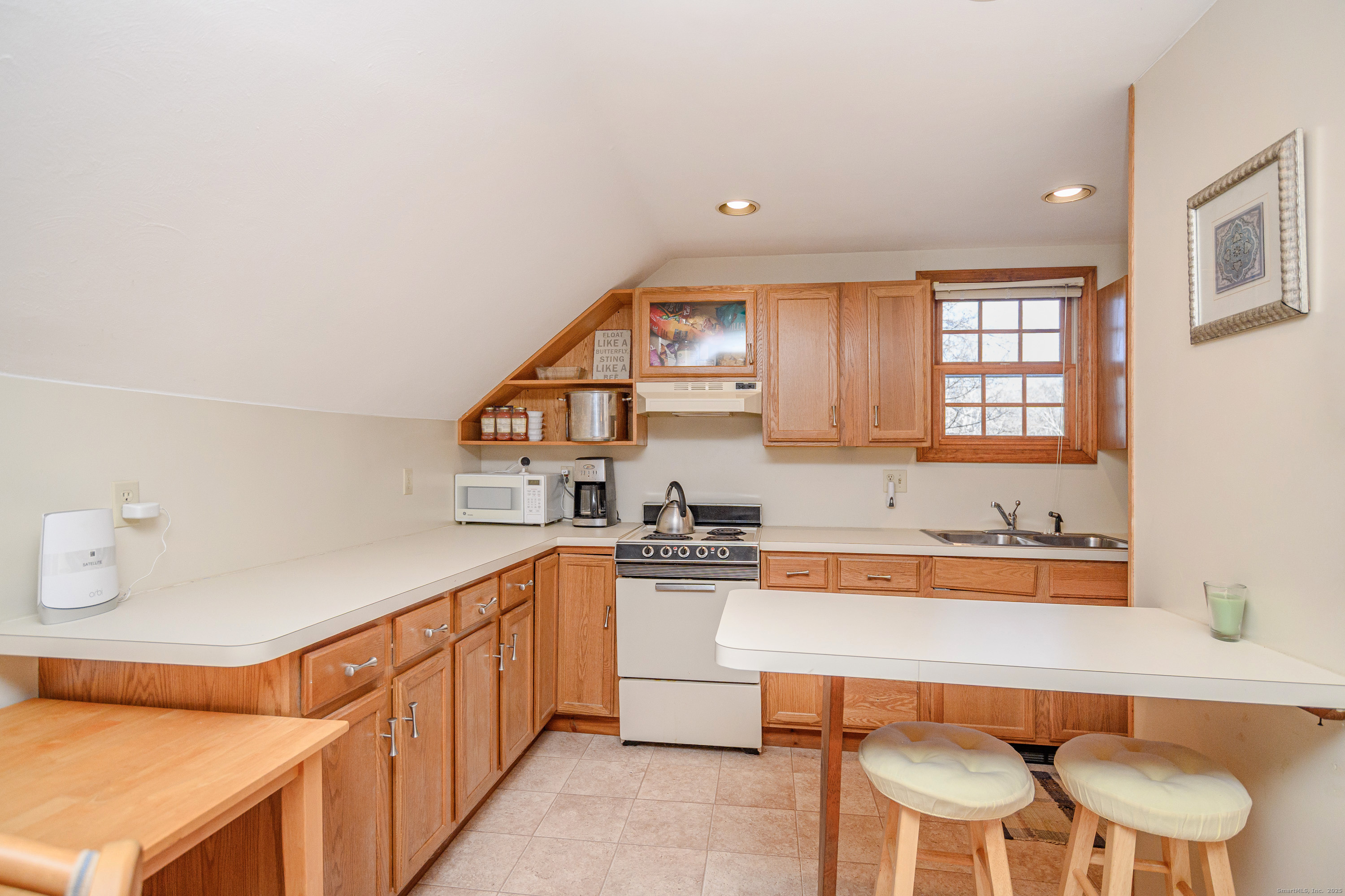 14 Concord Ridge Road Newtown, CT 06482 - Photo 27 of 40 a kitchen with stainless steel appliances a sink and a cabinets