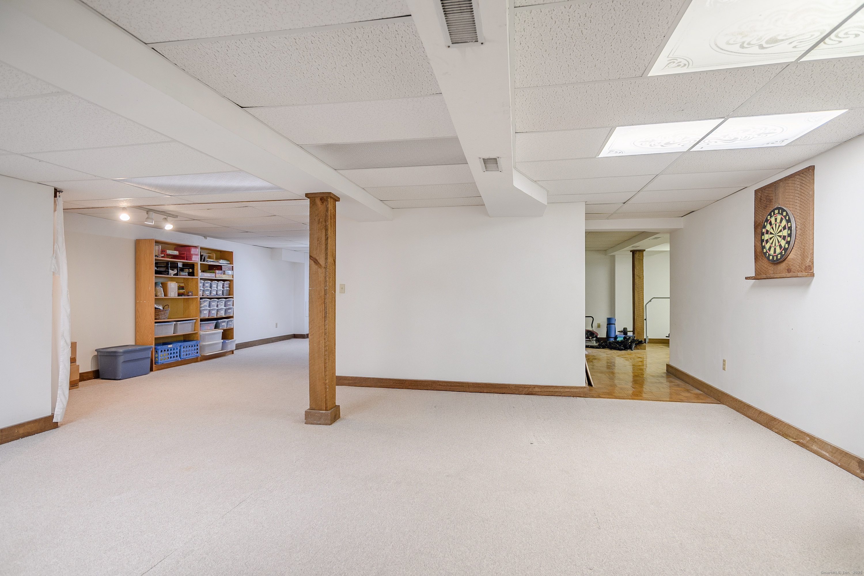 14 Concord Ridge Road Newtown, CT 06482 - Photo 29 of 40 a view of a livingroom with wooden floor and closet