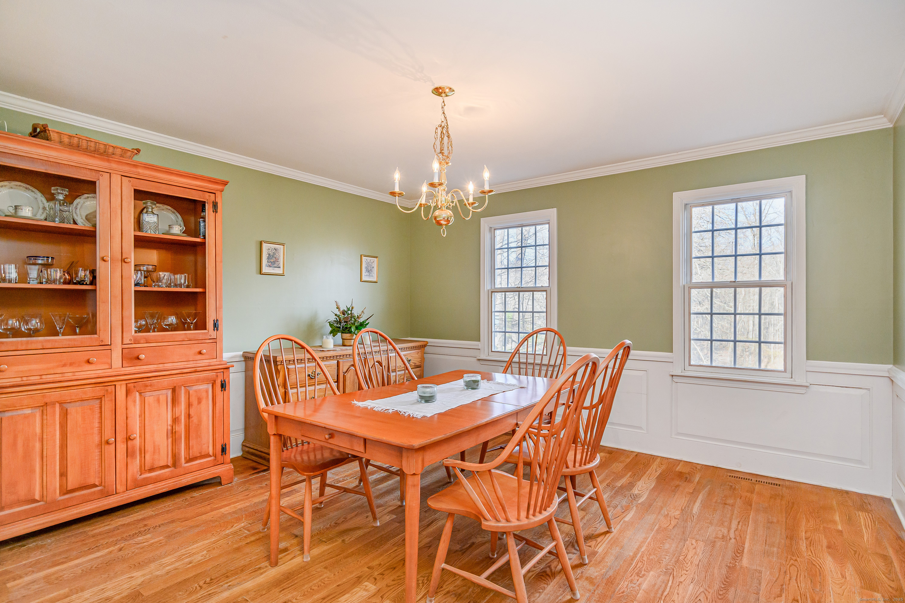 14 Concord Ridge Road Newtown, CT 06482 - Photo 7 of 40 a dining room with furniture a chandelier and wooden floor