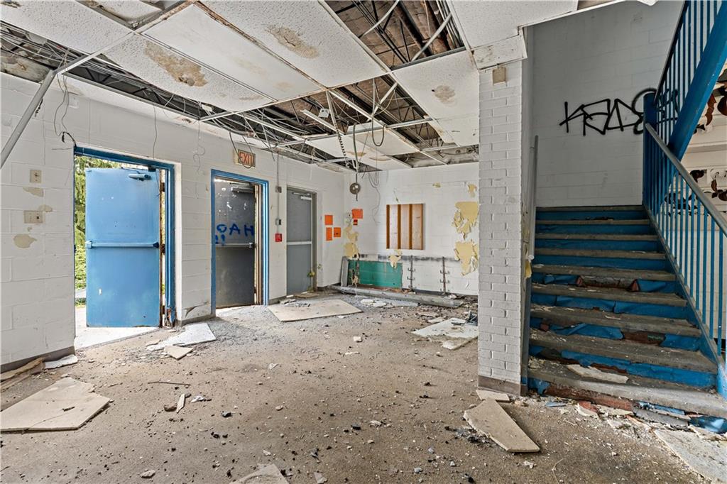 101 Hazlett Street Pittsburgh, PA 15214 - Photo 16 of 37 a view of a hallway with wooden walls