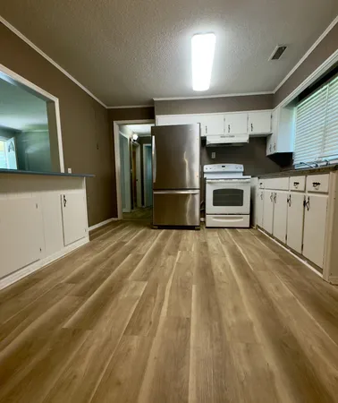 a view of a kitchen with a sink