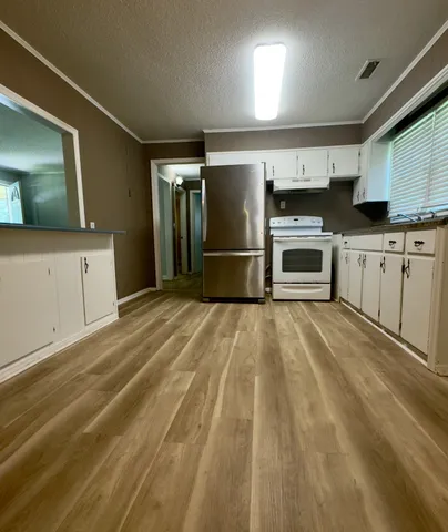 a view of a kitchen with a sink