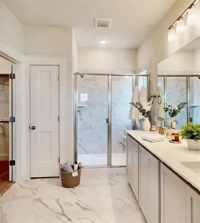 a bathroom with a double sink shower and a mirror