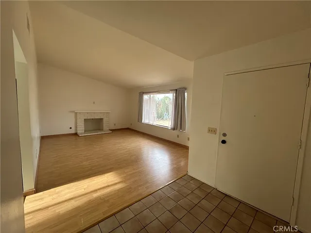 a view of an empty room and window