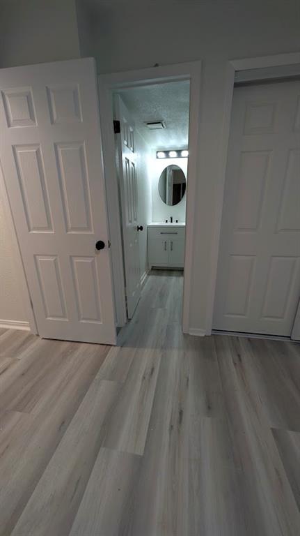 2240 Tarpley Road, Unit 92 Carrollton, TX 75006 - Photo 12 of 17 a view of a hallway with wooden floor