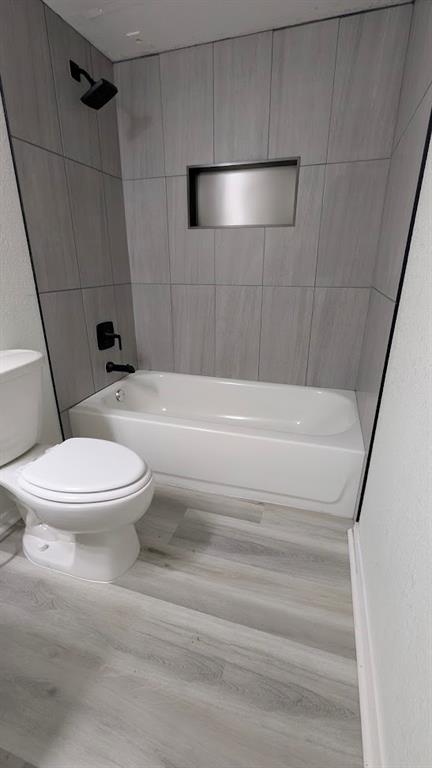 2240 Tarpley Road, Unit 92 Carrollton, TX 75006 - Photo 14 of 17 a bathroom with a toilet and a shower