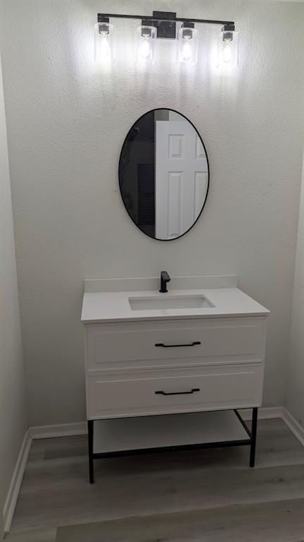 2240 Tarpley Road, Unit 92 Carrollton, TX 75006 - Photo 16 of 17 a bathroom with a sink and a mirror