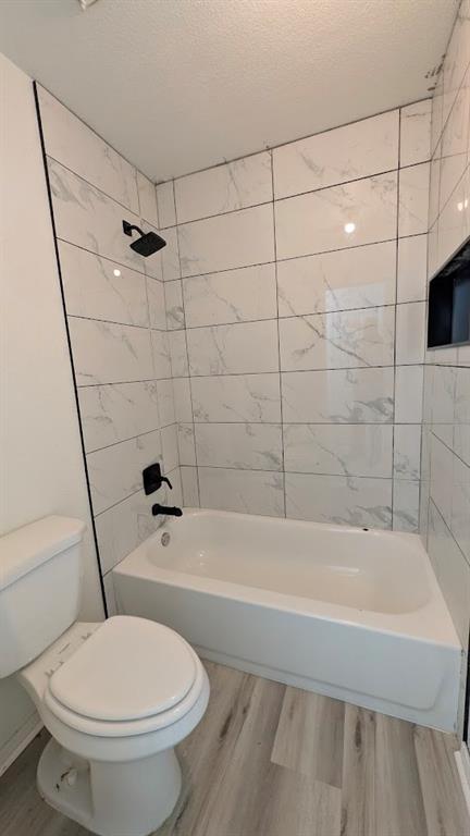 2240 Tarpley Road, Unit 92 Carrollton, TX 75006 - Photo 17 of 17 a bathroom with a toilet and a bathtub