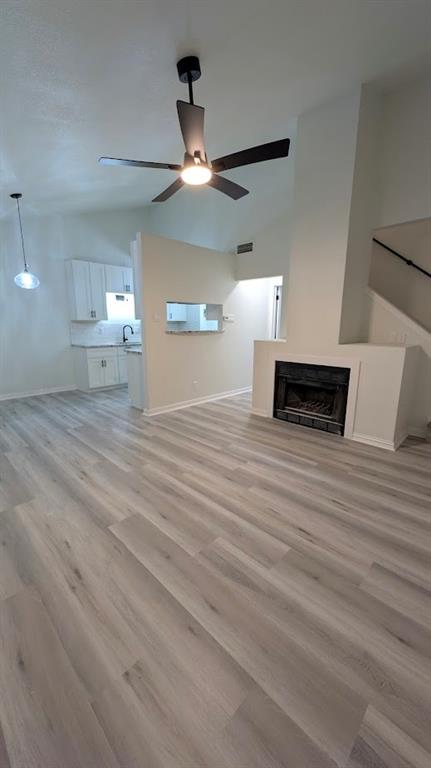 2240 Tarpley Road, Unit 92 Carrollton, TX 75006 - Photo 2 of 17 a view of a livingroom with a ceiling fan wooden floor and a ceiling fan
