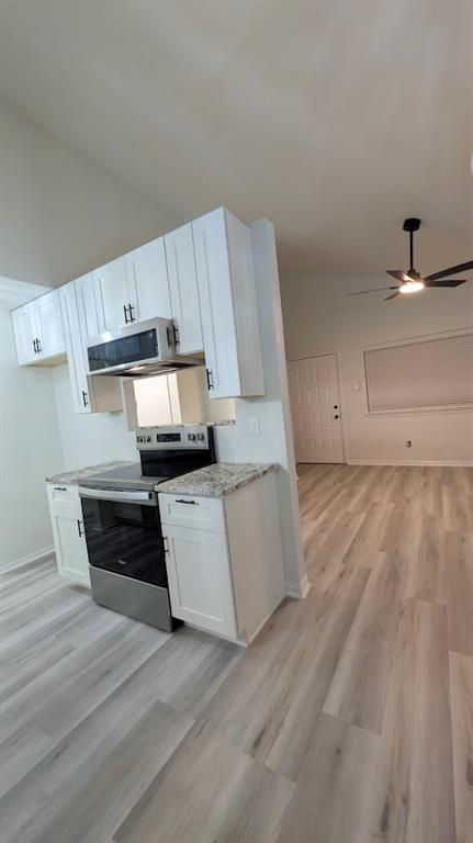 2240 Tarpley Road, Unit 92 Carrollton, TX 75006 - Photo 7 of 17 a kitchen with kitchen island granite countertop a sink and a stove top oven
