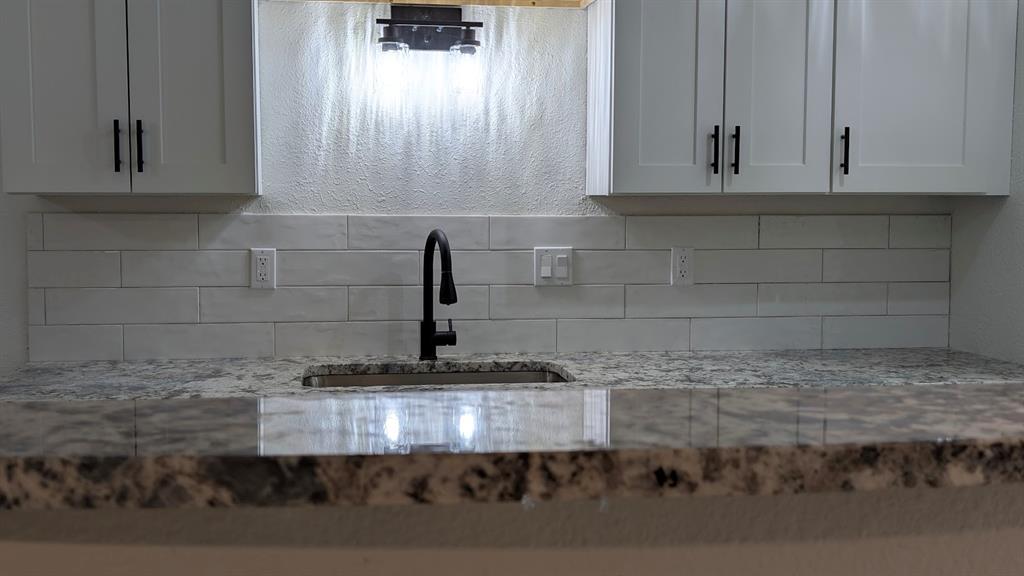 2240 Tarpley Road, Unit 92 Carrollton, TX 75006 - Photo 8 of 17 a kitchen with a sink and cabinets