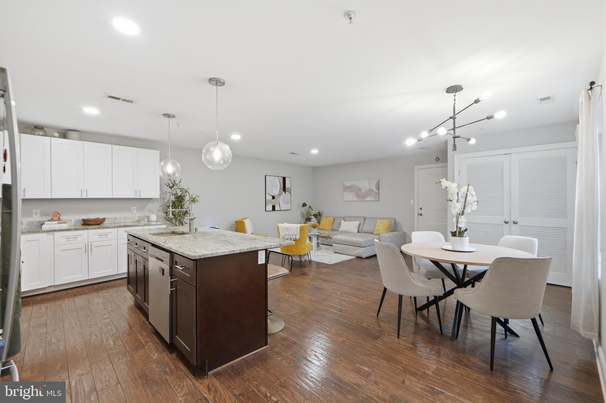 1258 Holbrook Terrace Northeast, Unit 5 Washington, DC 20002 - Photo 12 of 25 a kitchen with a table and chairs in it