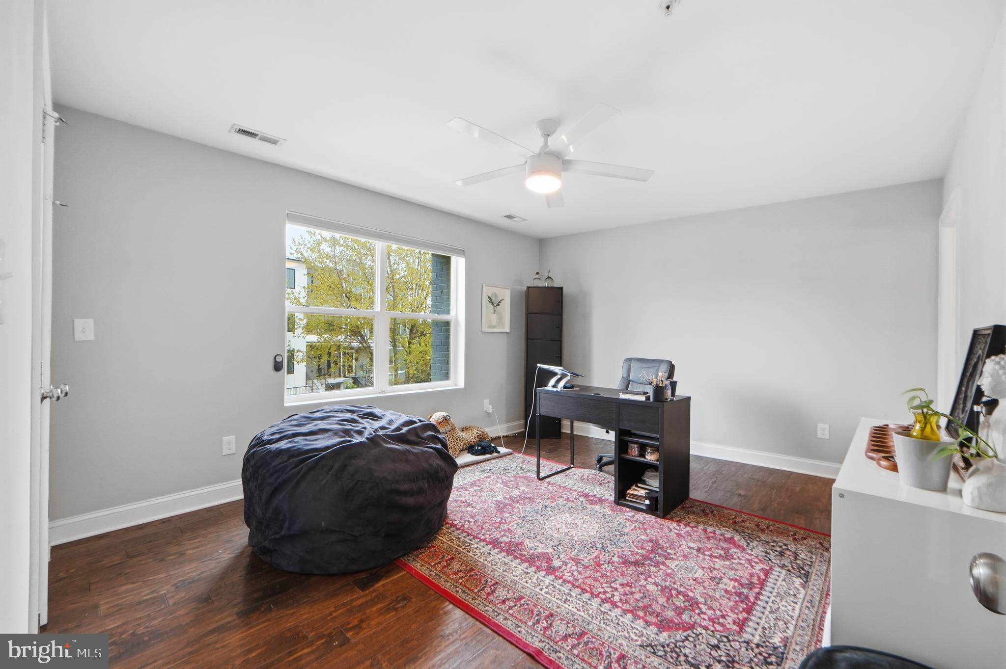 1258 Holbrook Terrace Northeast, Unit 5 Washington, DC 20002 - Photo 15 of 25 a living room with furniture and a window